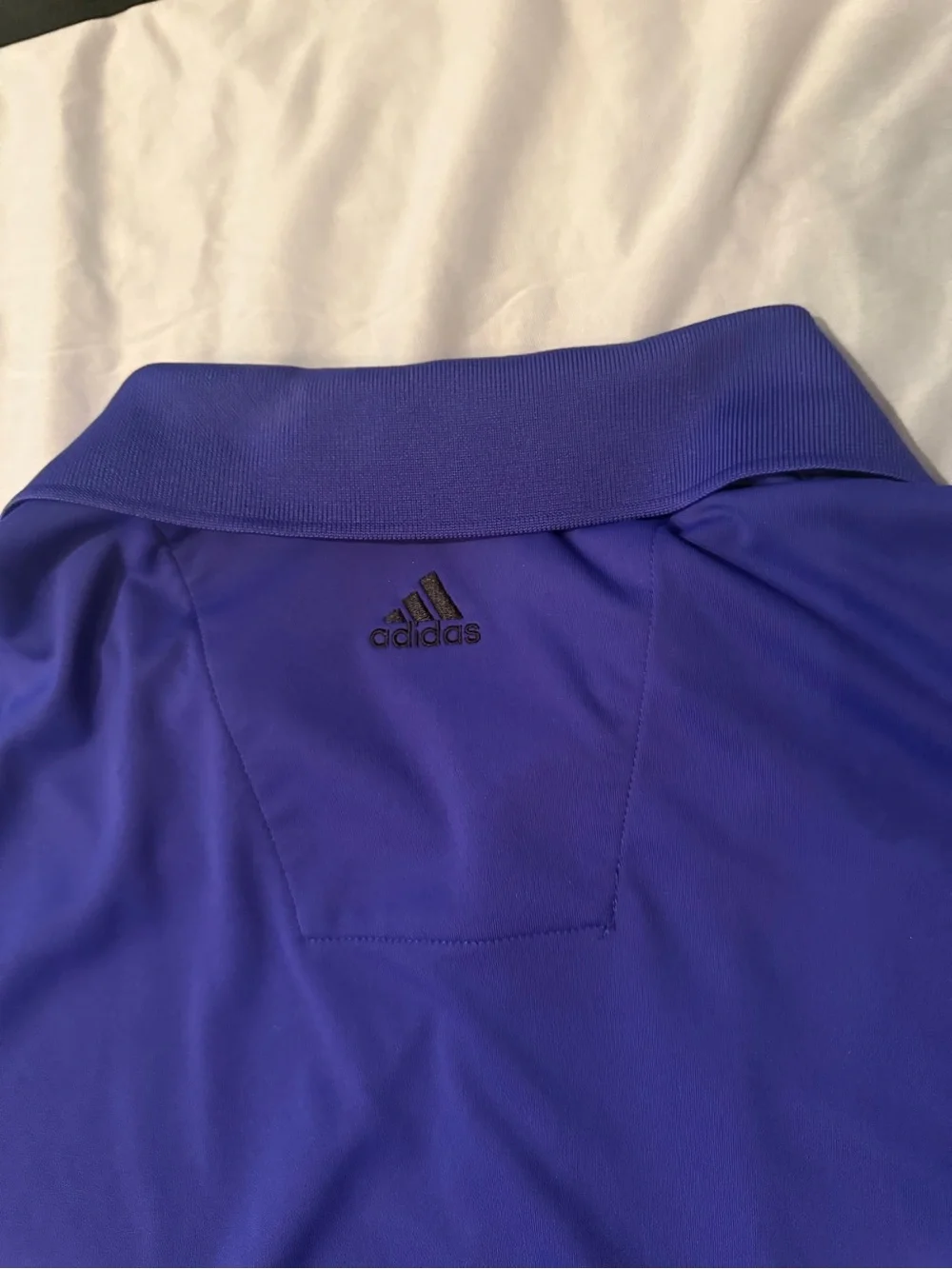 adidas Men's Blue Polo Shirt with Subtle Black Stripe Accents